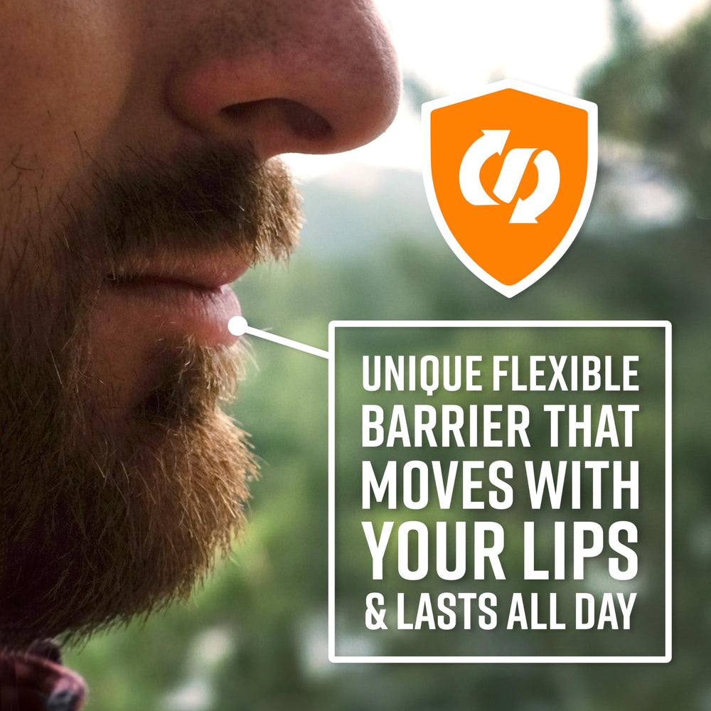 O'Keeffe's Lip Repair unscented stick held in hand for portable care
