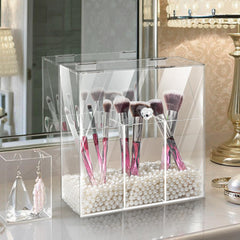 Okllen clear acrylic organizer with three compartments for cosmetics and jewelry.