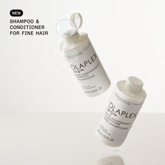 Creamy lather texture of Olaplex Nº.4 FINE demonstrating gentle cleansing benefit