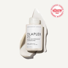 Olaplex Nº.5 conditioner texture on hand showing creamy concentrate and easy application benefit