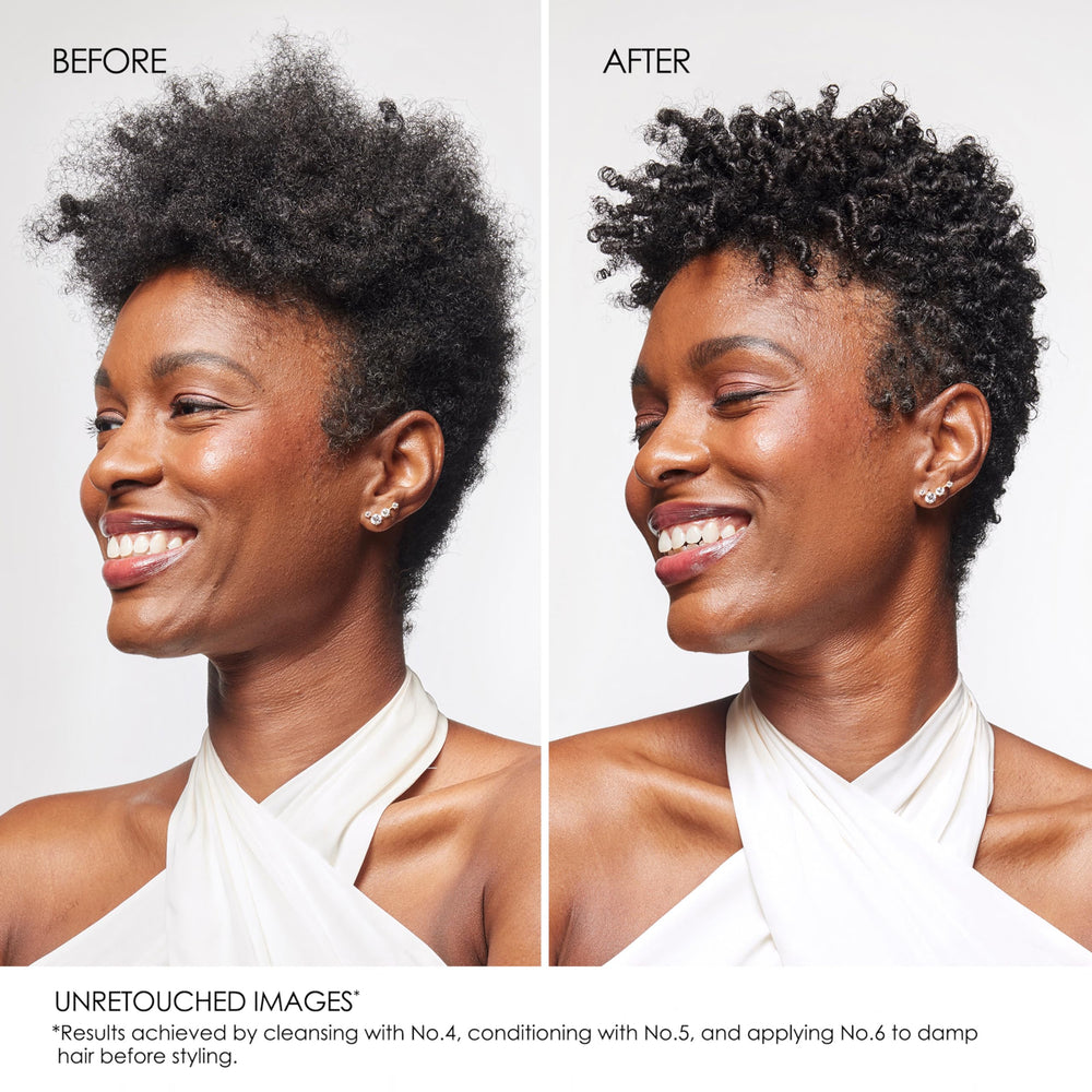 Applying Olaplex Nº.5 to mid-lengths and ends in shower for easier detangling