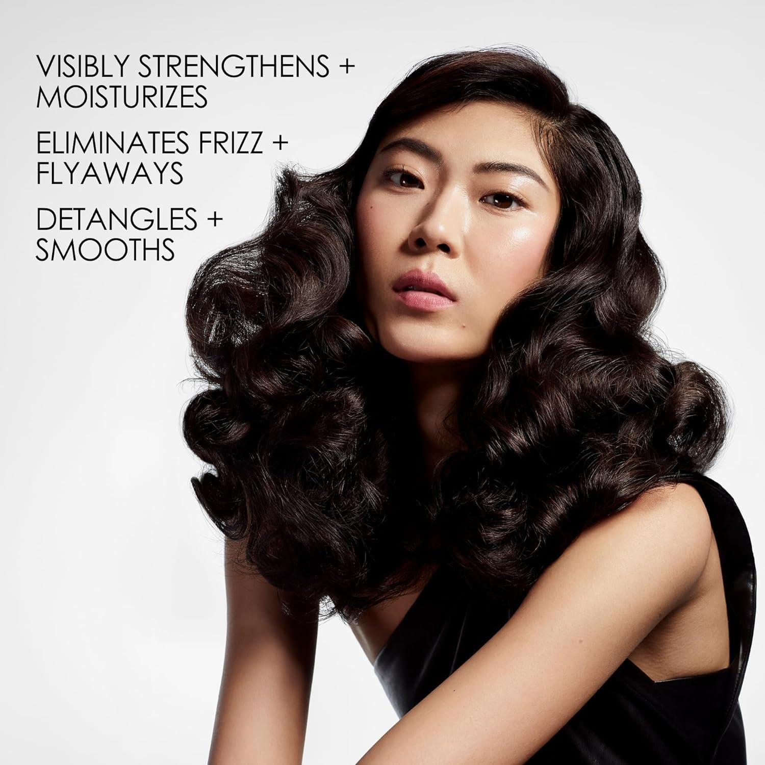 Olaplex Nº.5 pump dispensing creamy conditioner showing rich texture benefit