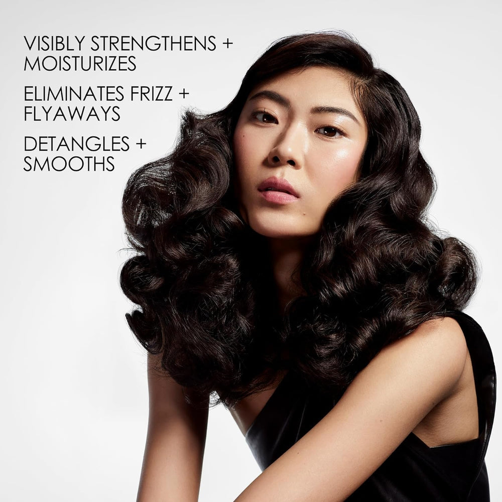 Olaplex Nº.5 pump dispensing creamy conditioner showing rich texture benefit