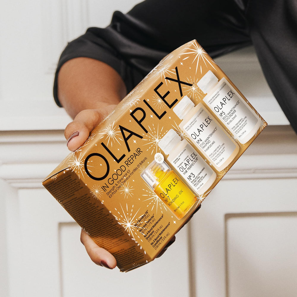 Olaplex No.7 Bonding Oil drop on hair strand illustrating shine and heat protection
