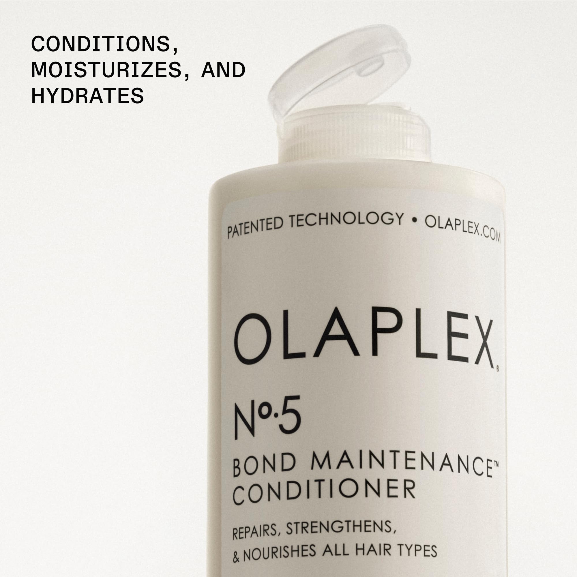 Applying Olaplex Nº.5 to mid-lengths to improve detangling and softness