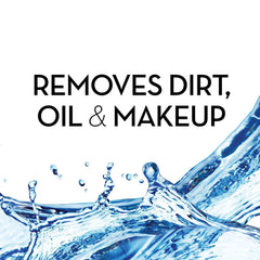 Cotton pad applying Olay toner to cleanse and remove oil.