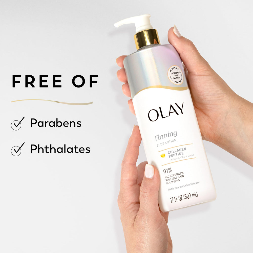 Olay bottle held in hand to show 17 fl oz scale and travel-friendly size