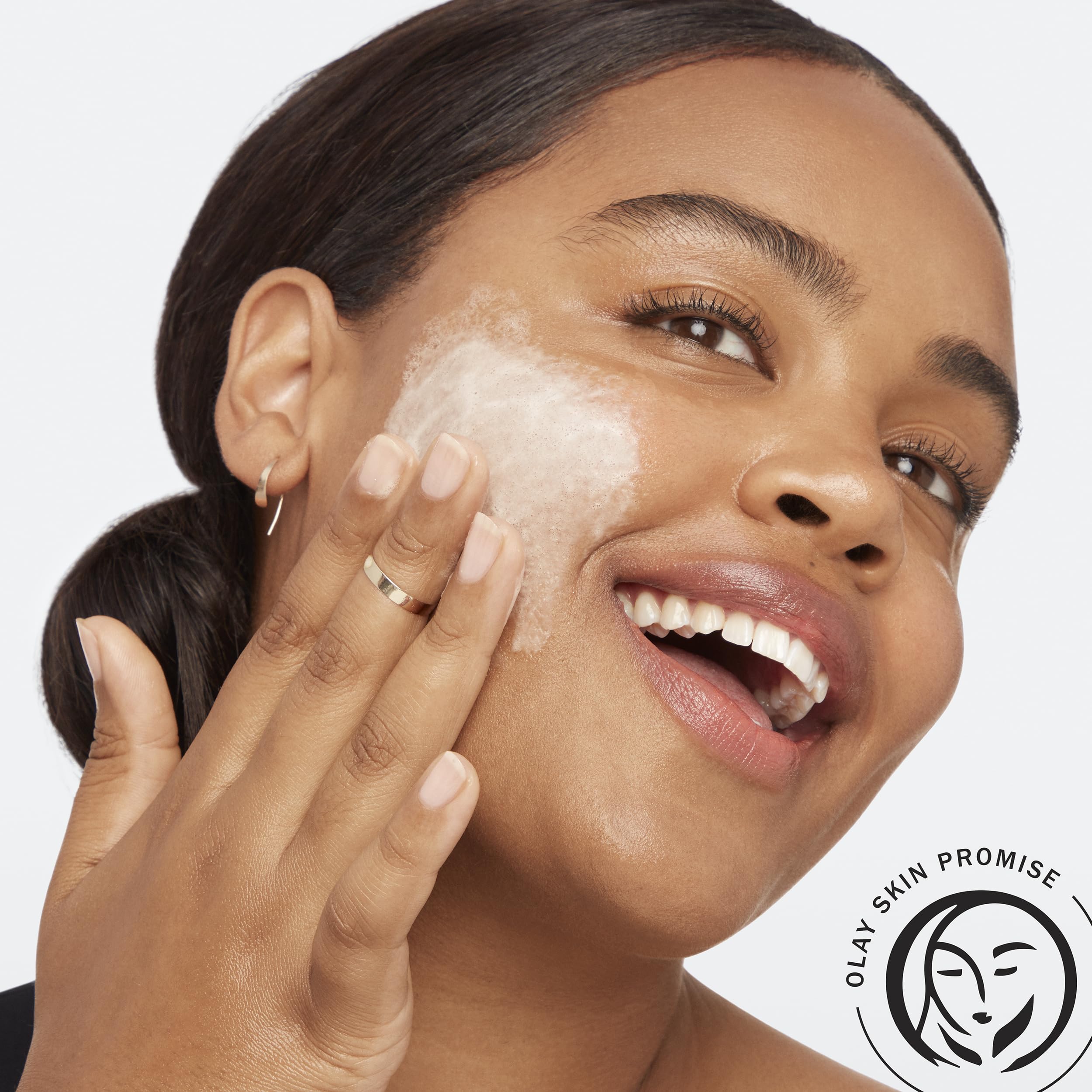 Olay Total Effects Citrus Cleanser texture closeup shows gentle exfoliating particles for smoother skin.