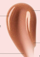 Ole Henriksen Pout Preserve swatch displays shimmering Creme Brulee Glimmer