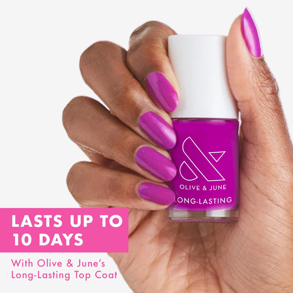 Olive & June grape soda nail polish brush applying even color across nails.