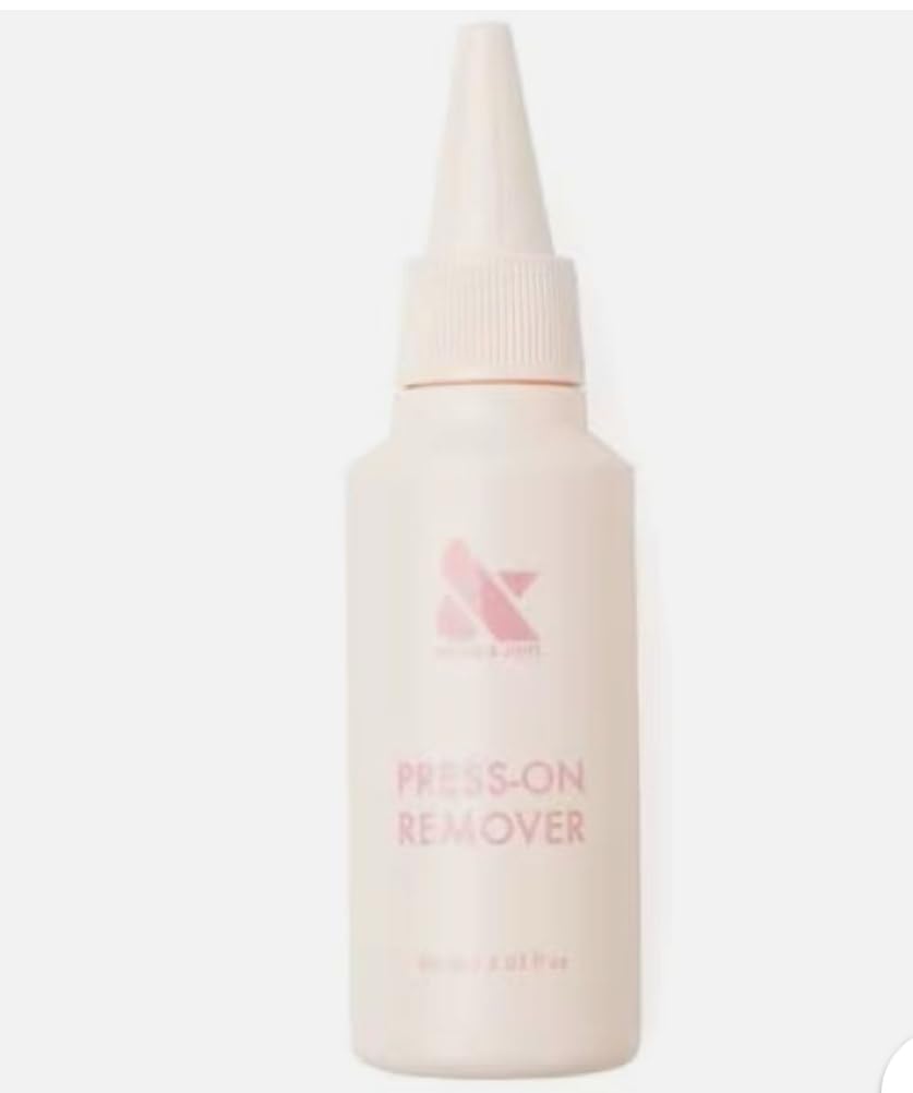 Olive & June Press-On Nail Remover Kit caps and wooden cuticle pusher shown for gentle, efficient removal.