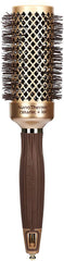 Olivia Garden NanoThermic NT-44 closeup highlighting ceramic-ion round brush for smooth, frizz-free finishes.
