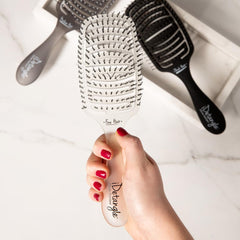 iDetangle tension-adjustment feature adapts to hair type for reduced snagging