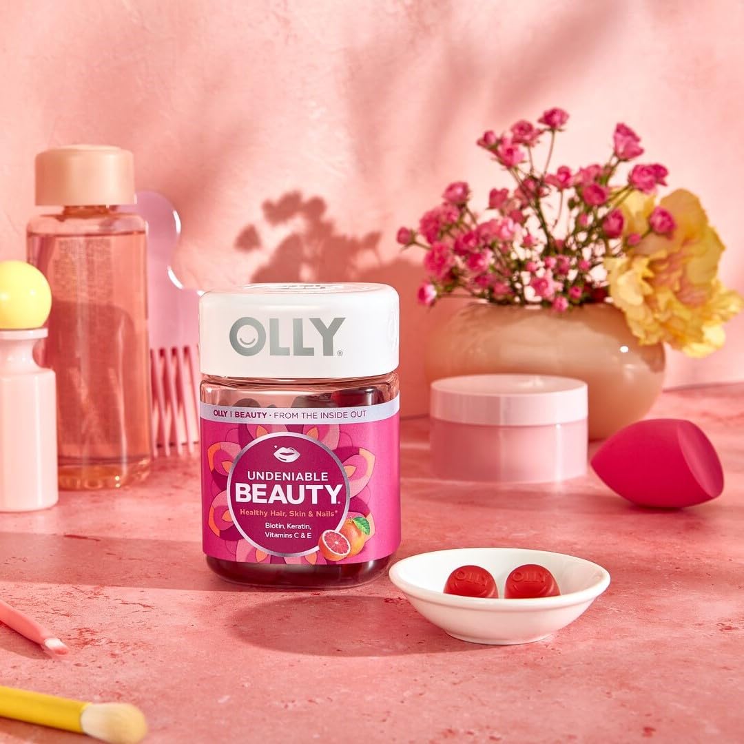 OLLY gummy beside a coin showing scale and easy-to-chew serving size