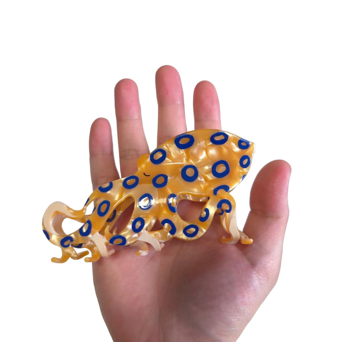 OMG Decor octopus clip displayed on a fashion board emphasizing durability.
