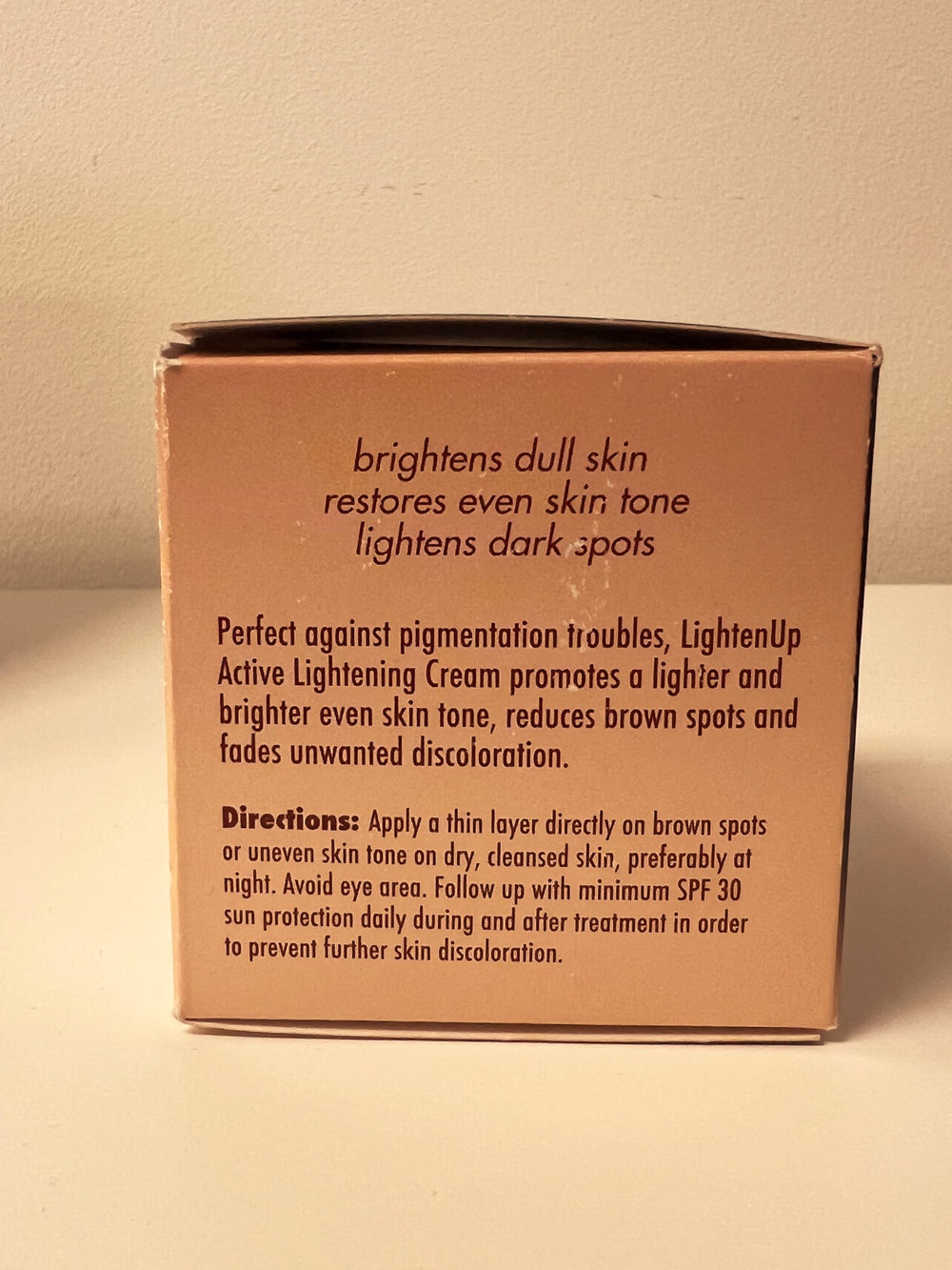 OMIC Lighten-Up Plus before-after visual suggests potential complexion improvement over time.