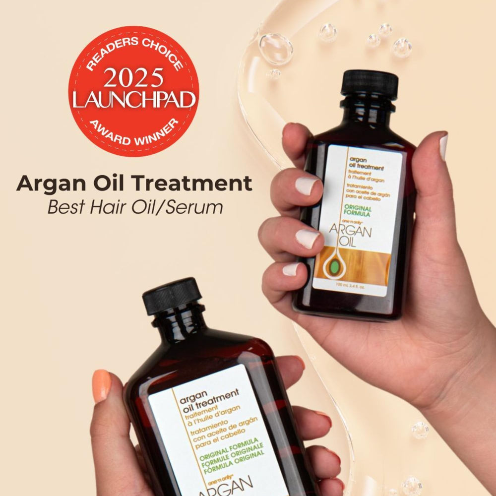 One 'N Only Argan Oil Hair Treatment drops on hand for lightweight hydration