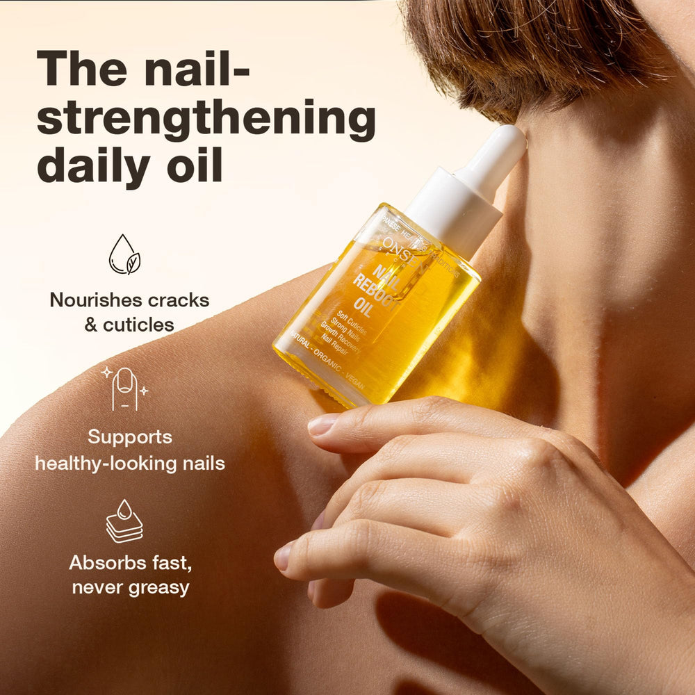 Onsen Secret Nail & Cuticle Oil applicator brush applying to nails