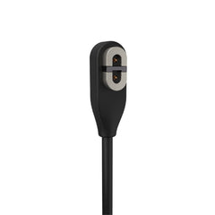 SHOKZ OpenRun Pro charger attached securely for travel-ready power