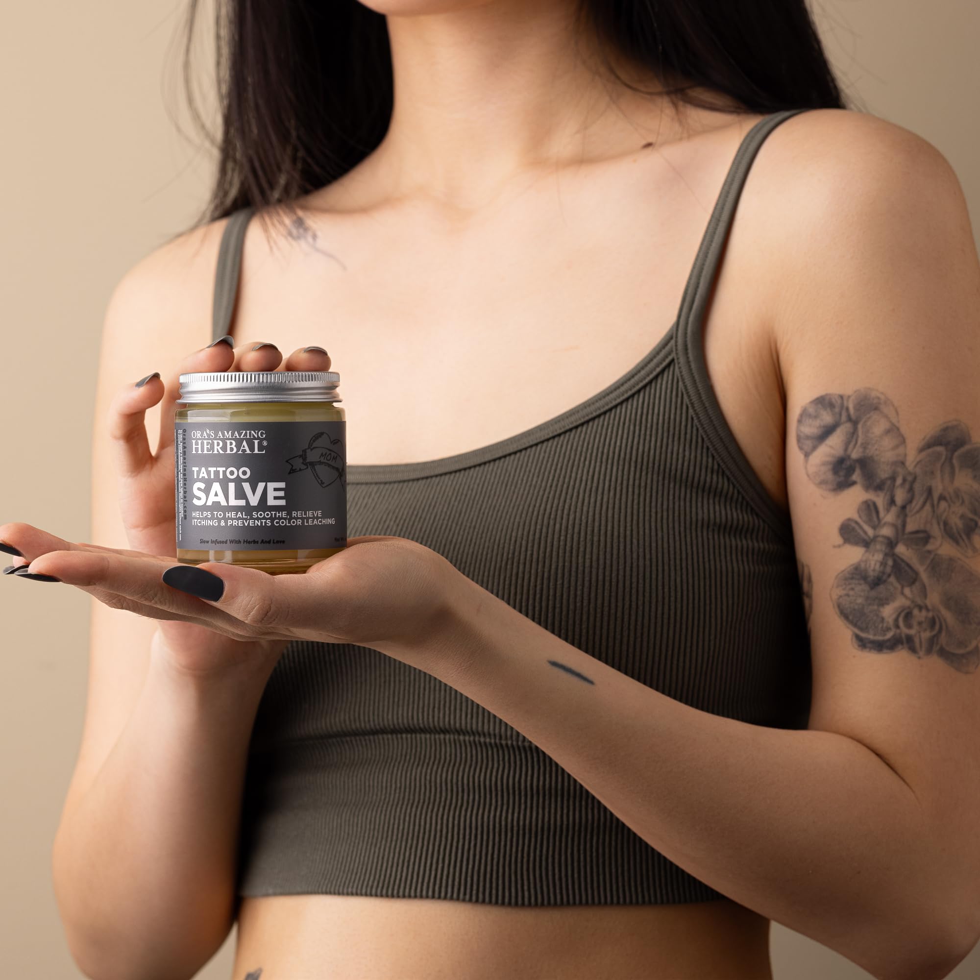 Ora's Amazing Herbal Tattoo Salve texture closeup highlights balm-like, light finish.