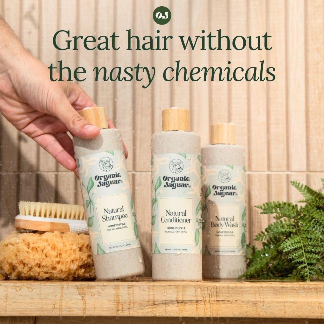 Organic Jaguar Honeysuckle Body Wash packaging on shelf in bathroom.