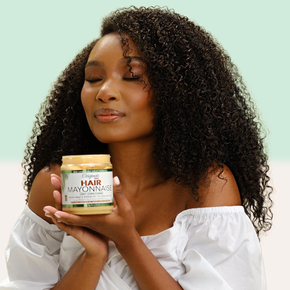 Originals by Africa's Best deep-conditioning application demonstrates creamy texture for hydration.