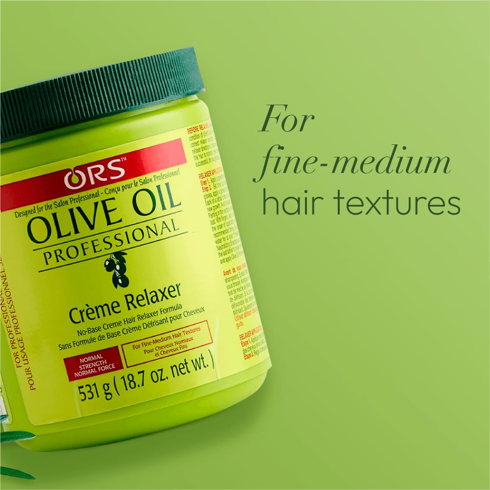 ORS Olive Oil Creme Relaxer bottle on counter with towel ready for routine.