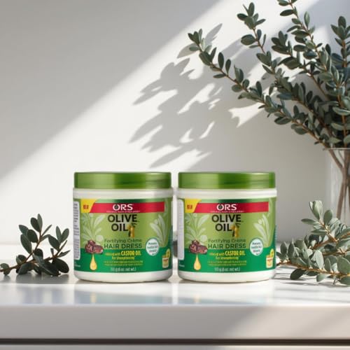 ORS Olive Oil Fortifying Cream Hair Dress being applied to hair for smooth finish