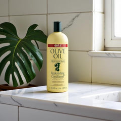 ORS Olive Oil Professional Replenishing Conditioner hair-ends close-up suggests smoother, more manageable strands.