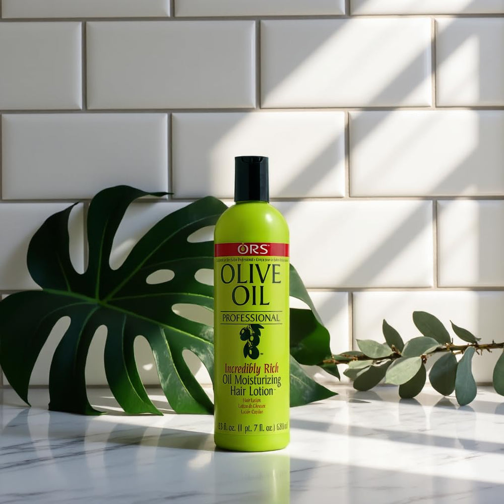 ORS Olive Oil Professional rich oil on frizz-prone hair for smoothness.