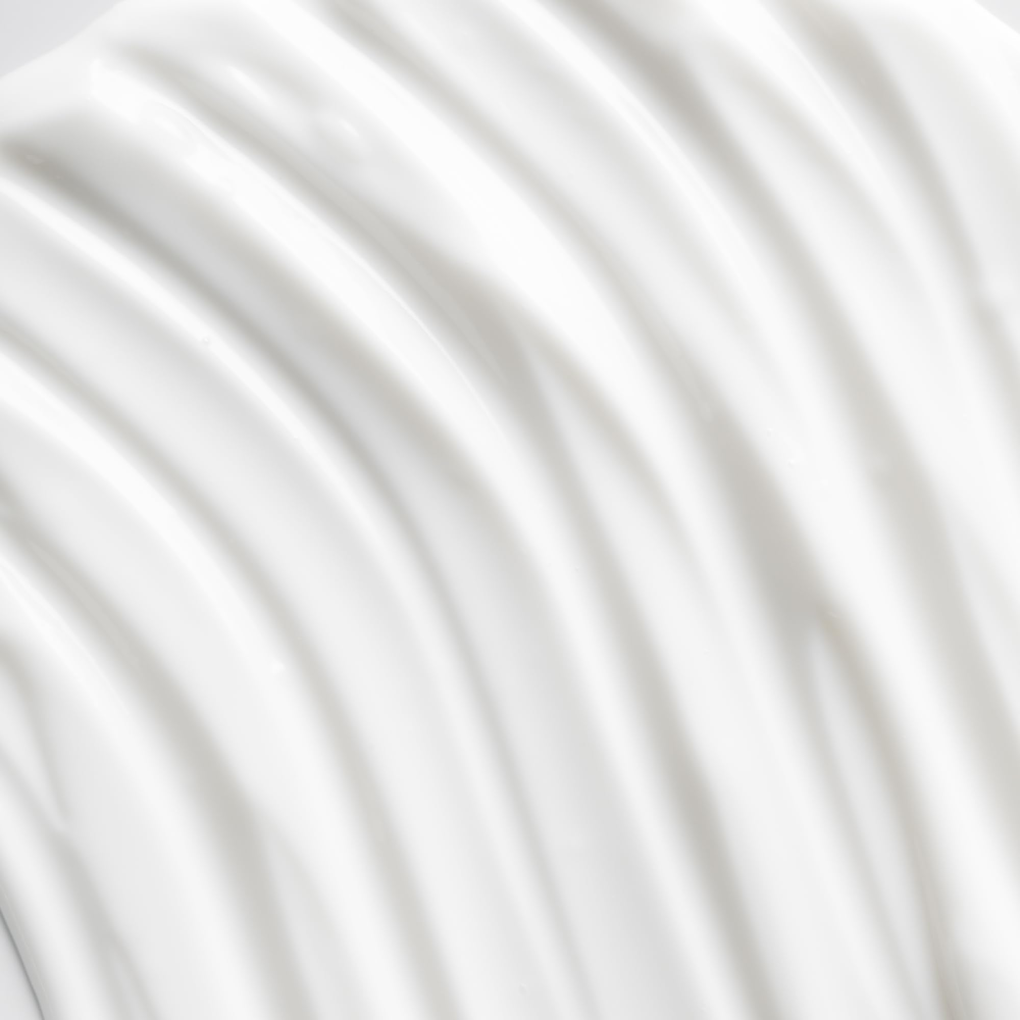 Osea advanced-protection-face-cream-application-on-cheek suggests daily moisturizing for comfort.