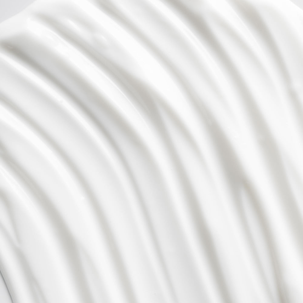 Osea advanced-protection-face-cream-application-on-cheek suggests daily moisturizing for comfort.