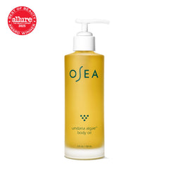 OSEA Undaria Algae Body Oil application on arm conveys instant suppleness and moisture.