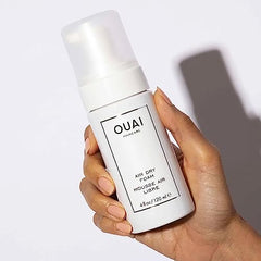 OUAI Air Dry Foam being scrunched into hair for texture
