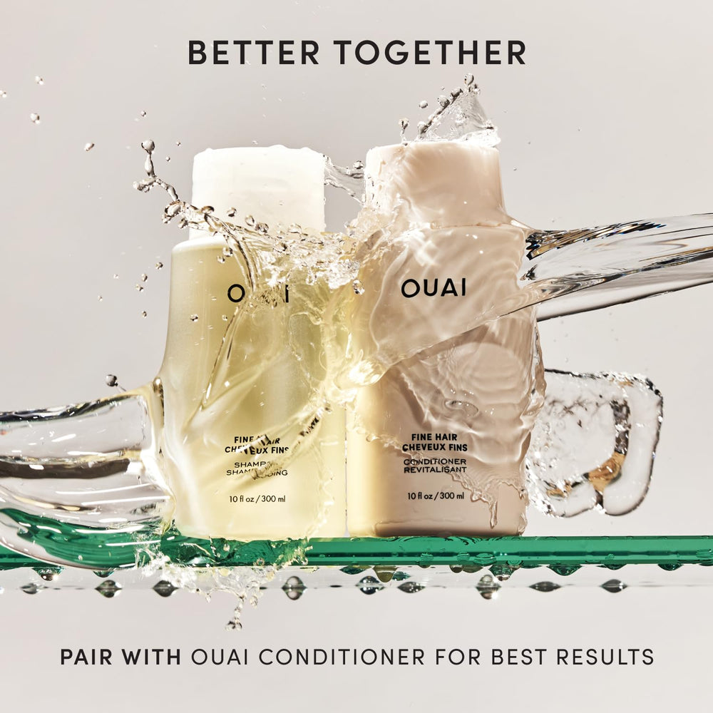 OUAI bathroom shelf shot featuring bottle beside towels