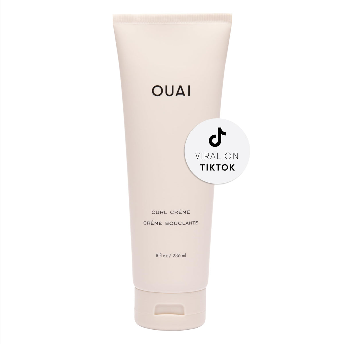 OUAI Curl Cream bottle closeup, silicone-free formula for defined, hydrated curls.