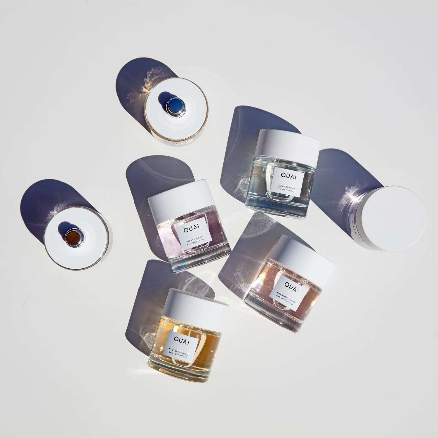 OUAI Dean Street EDP against a clean surface highlighting magnolia and musk notes.