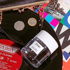 OUAI Dean Street packaging close-up highlighting its refined, fresh floral profile.