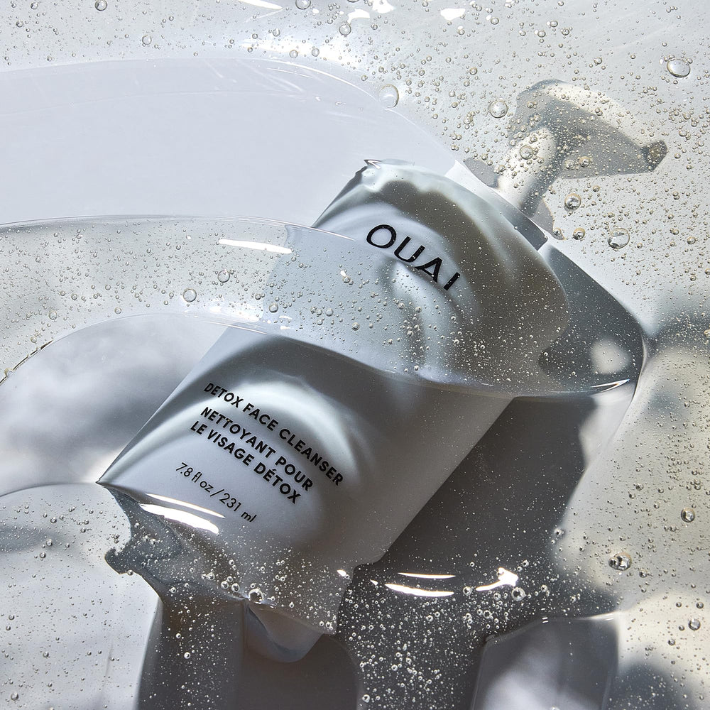 OUAI Detox bottle with damp skin in morning light suggests hydration-friendly cleansing