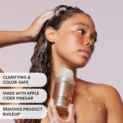 OUAI Detox Shampoo wet-hair application shows easy massaging cleanse.