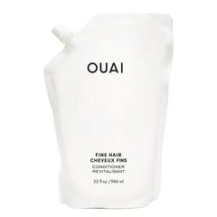 OUAI Fine Hair Conditioner Refill bottle closeup showing potential soft volume