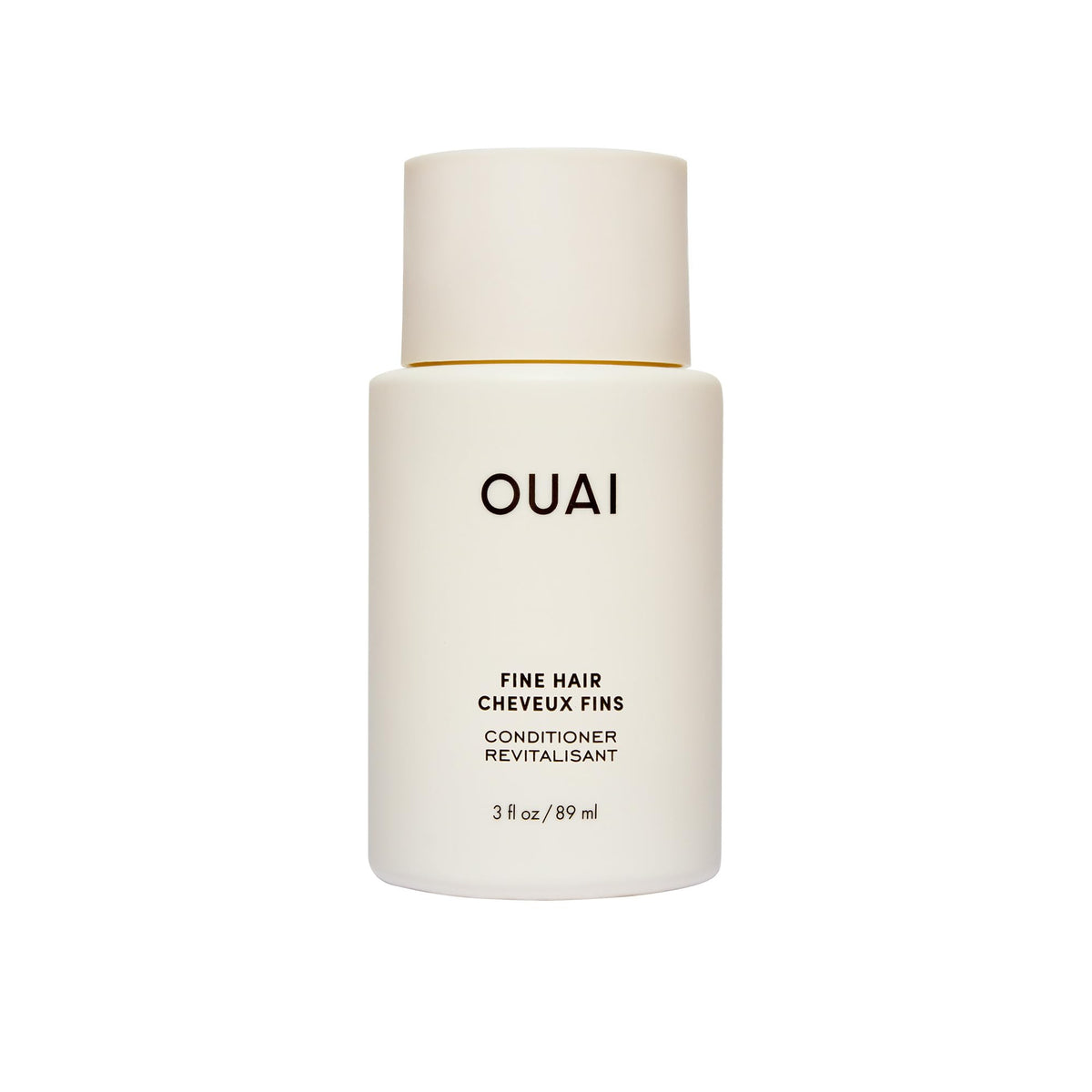 OUAI fine hair conditioner travel-size bottle closeup showing lightweight hydration