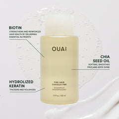OUAI Fine Shampoo travel-size bottle pouring lather for clean, bouncy strands