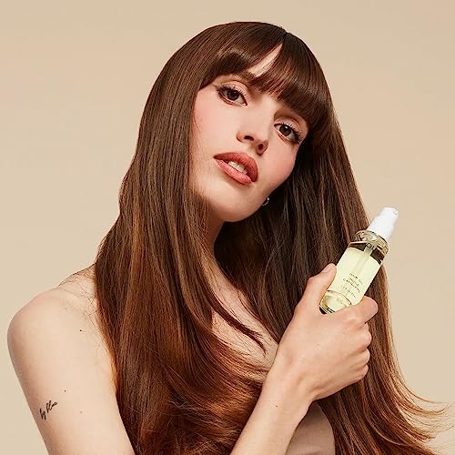 OUAI Hair Oil showcases frizz-control effect for humid days.