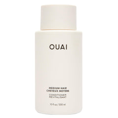 OUAI Medium Conditioner bottle front view for hydrated, frizz-controlled hair.