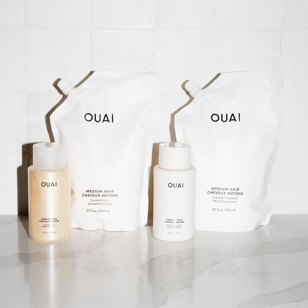 OUAI Medium Conditioner repair for damaged hair with nourishing hydration.