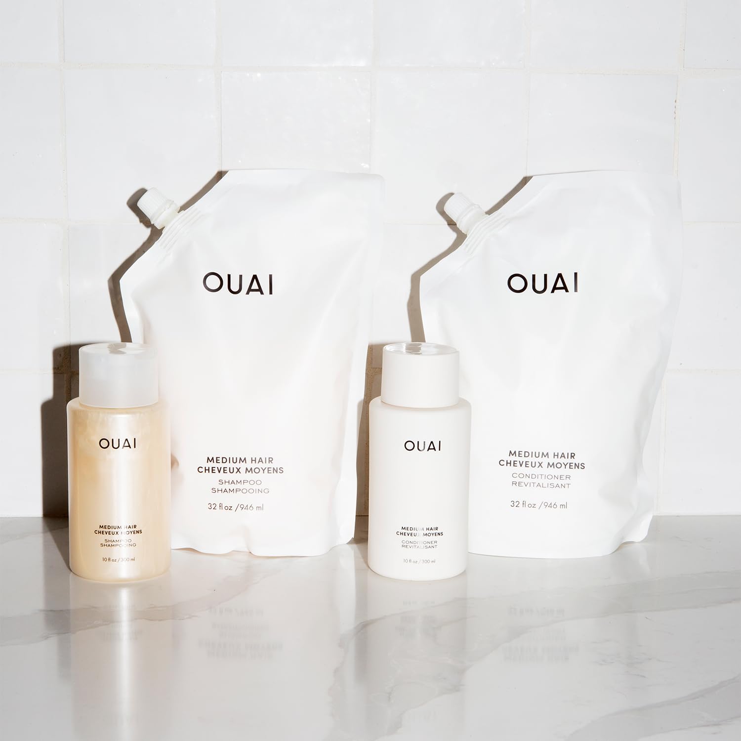 OUAI Medium Shampoo Refill demonstrates hair shine after wash.