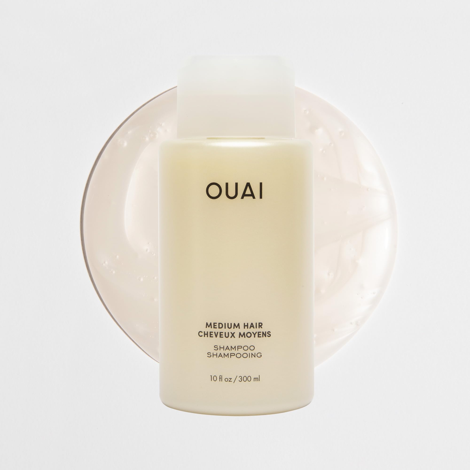 OUAI Medium Shampoo Travel Size cap close-up shows secure, travel-friendly lid.