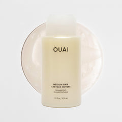 OUAI Medium Shampoo Travel Size cap close-up shows secure, travel-friendly lid.