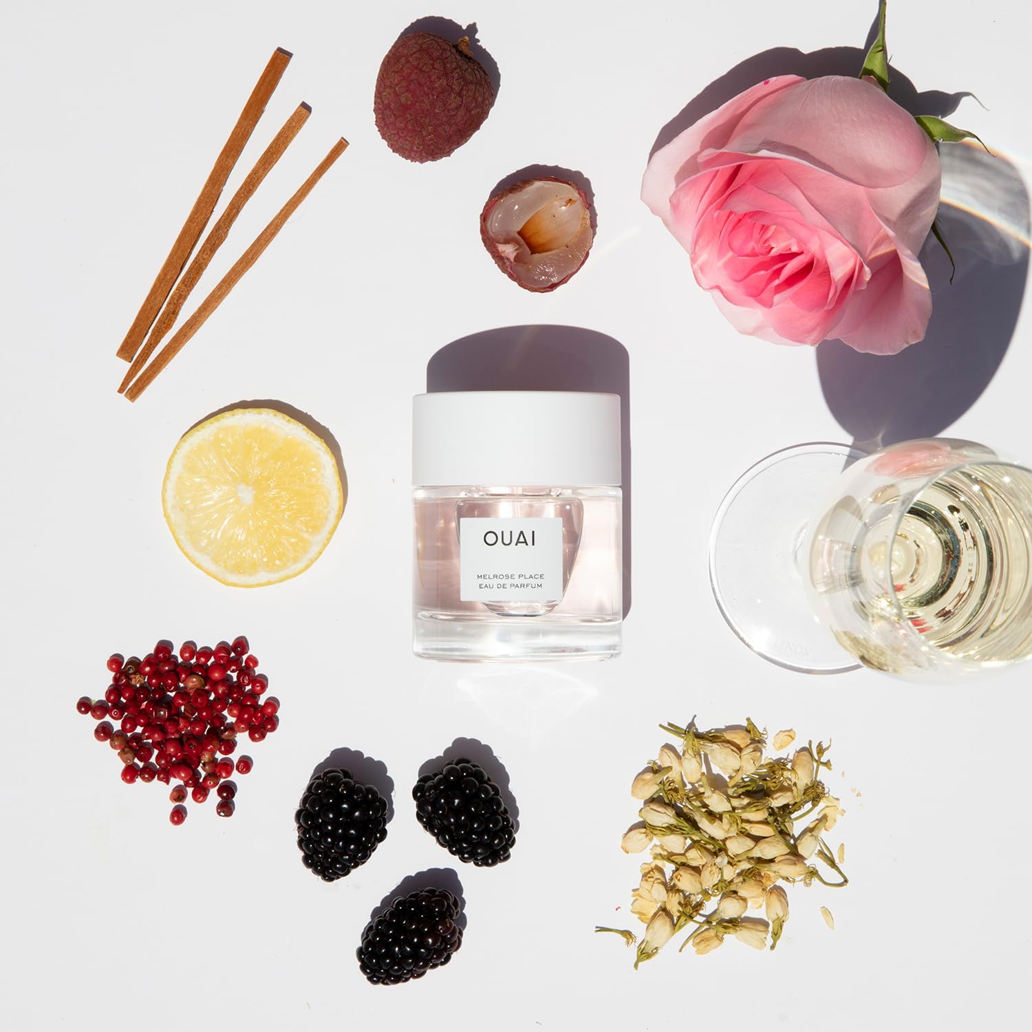 OUAI Melrose Place rose-freesia closeup communicates crisp, feminine fragrance for daily freshness.